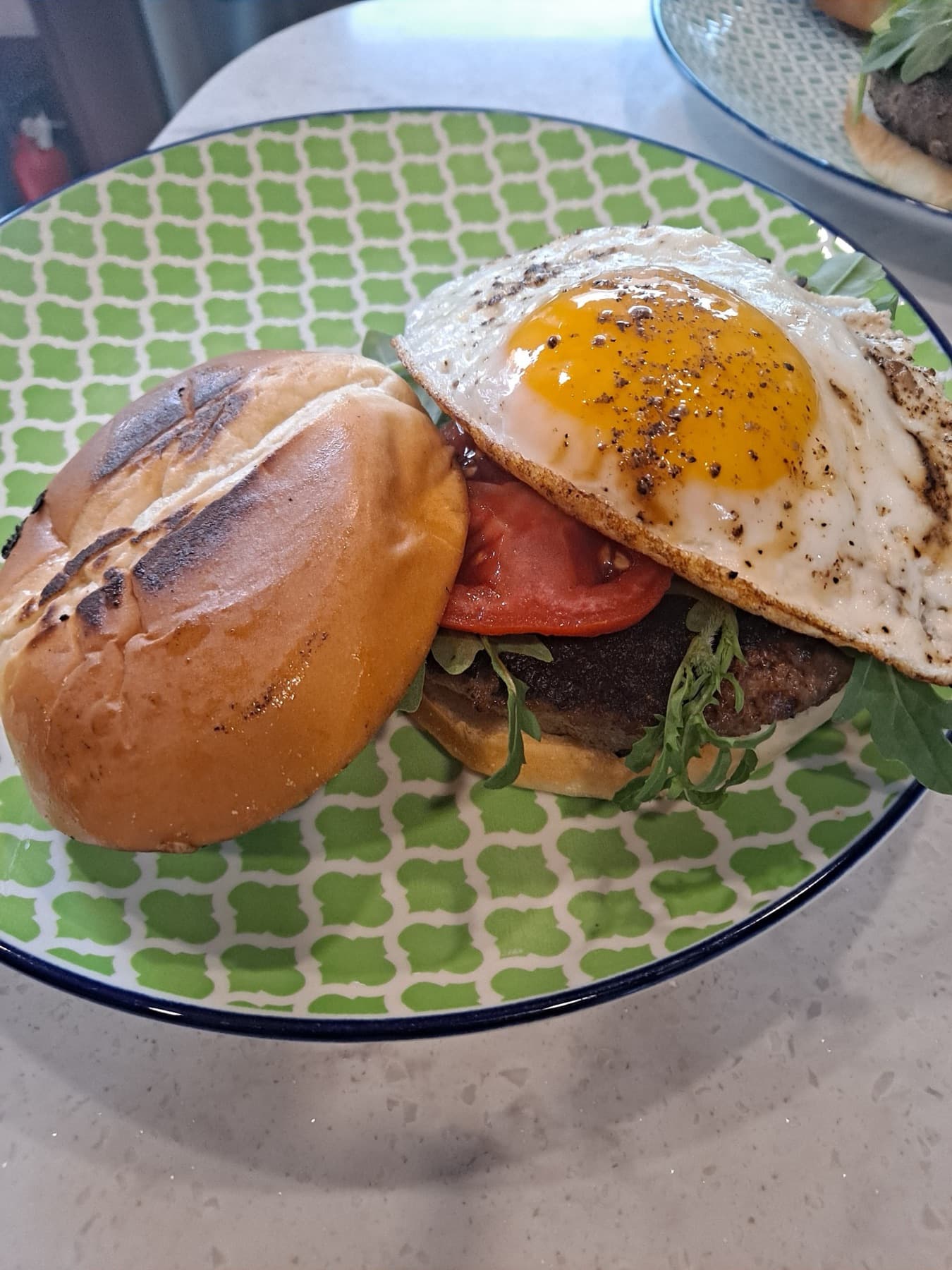 Grass-fed burger topped with a fried egg